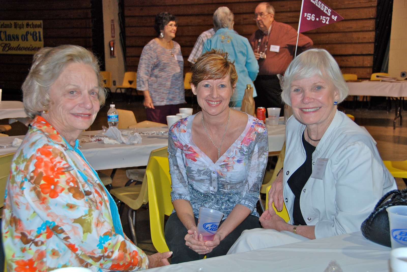 Debbie chatting with our mother's classmates of '55.JPG