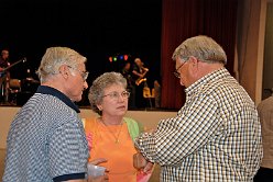 Phil Cranston '63 and his lovely bride Suzie chatting with George Rea Walker